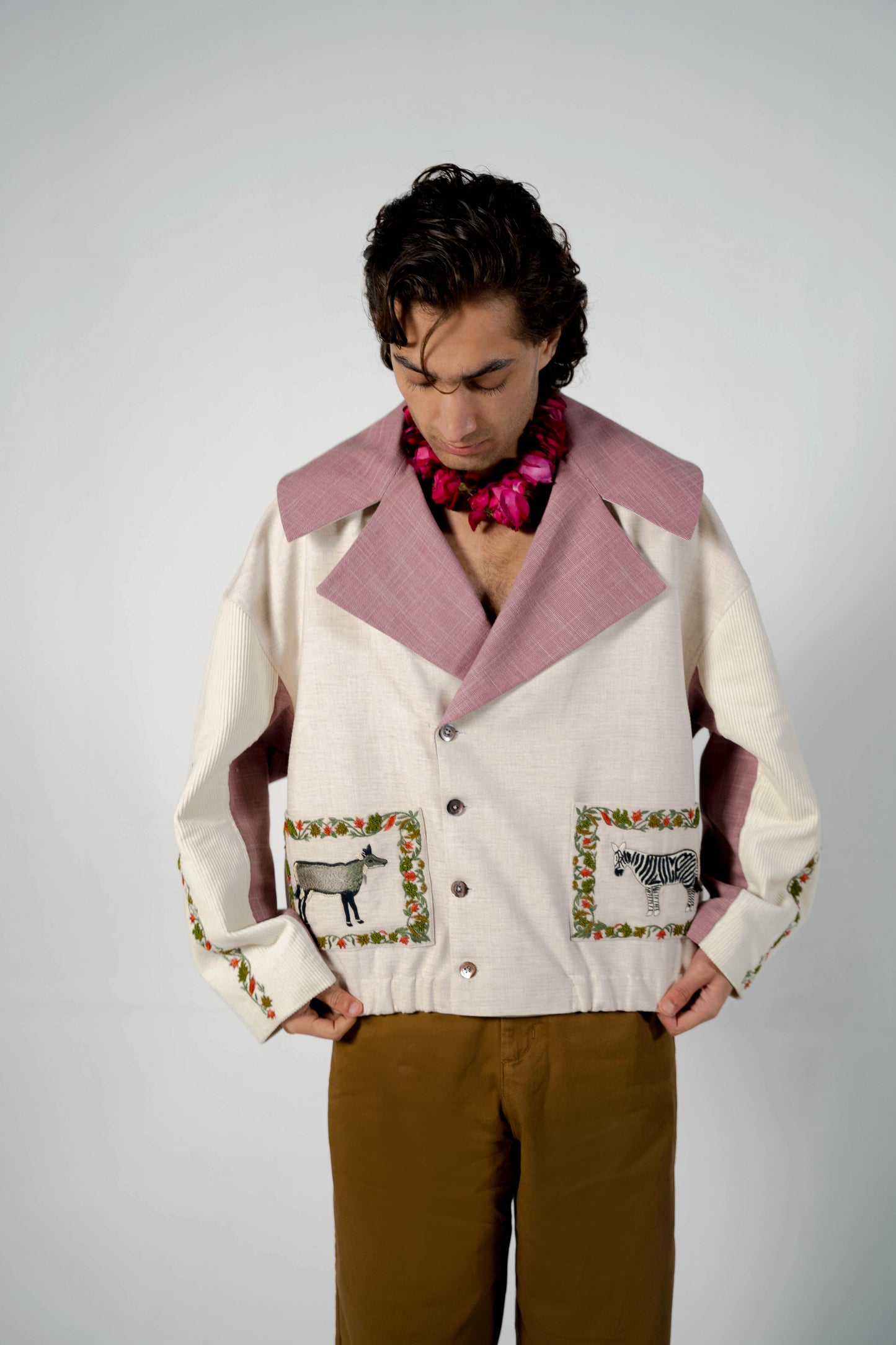 This unisex jacket features an oversized double lapel crop silhouette and mulberry silk liniing.