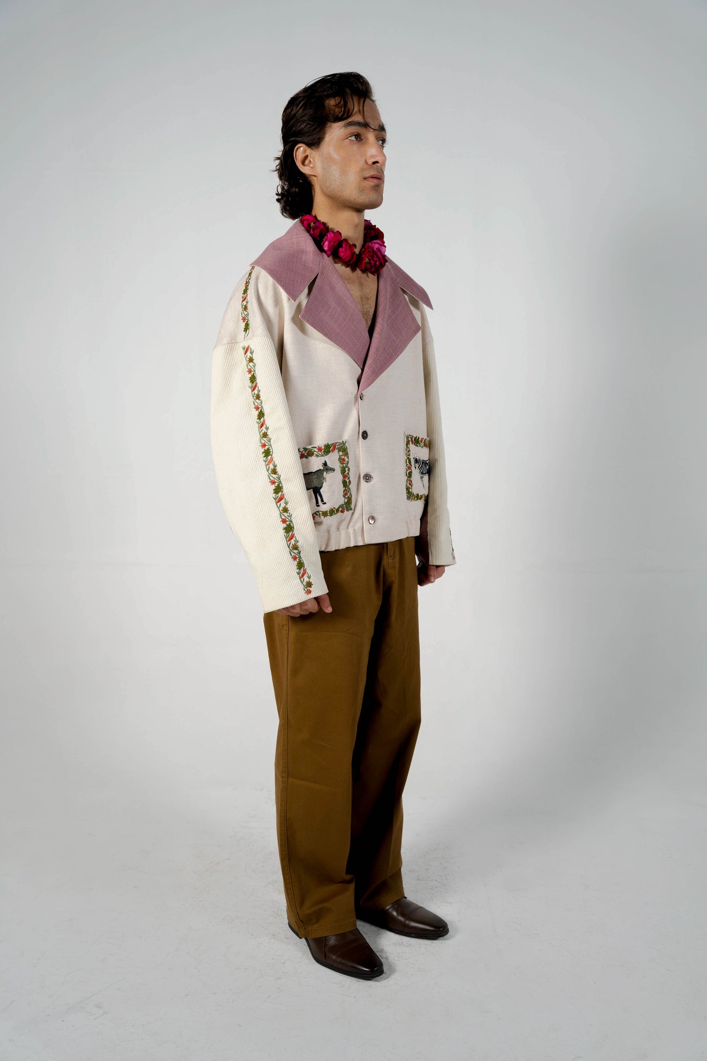 This unisex jacket features an oversized double lapel crop silhouette and mulberry silk liniing.