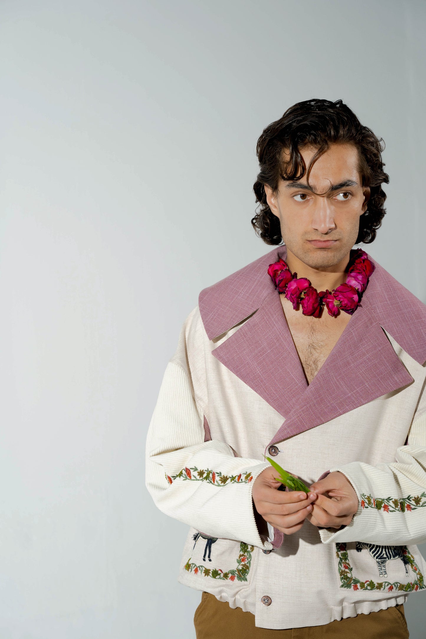 This unisex jacket features an oversized double lapel crop silhouette and mulberry silk liniing.