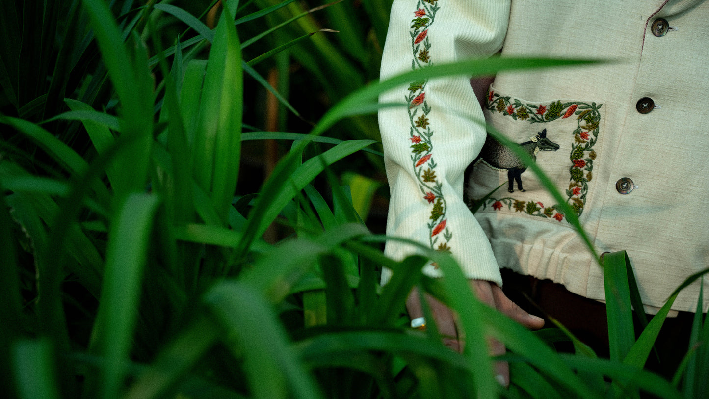This unisex jacket features an oversized double lapel crop silhouette and mulberry silk liniing.
