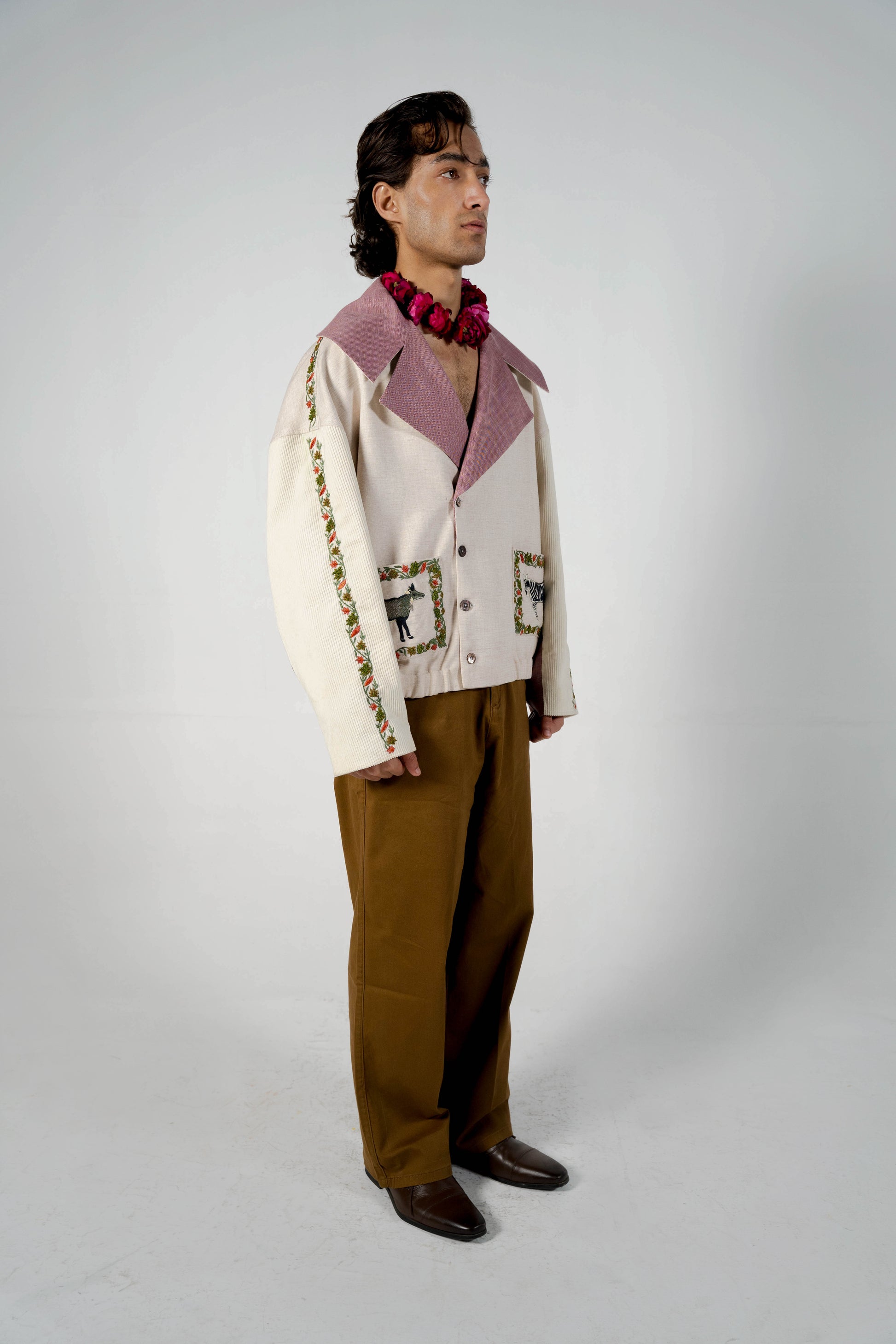 This unisex jacket features an oversized double lapel crop silhouette and mulberry silk liniing. 