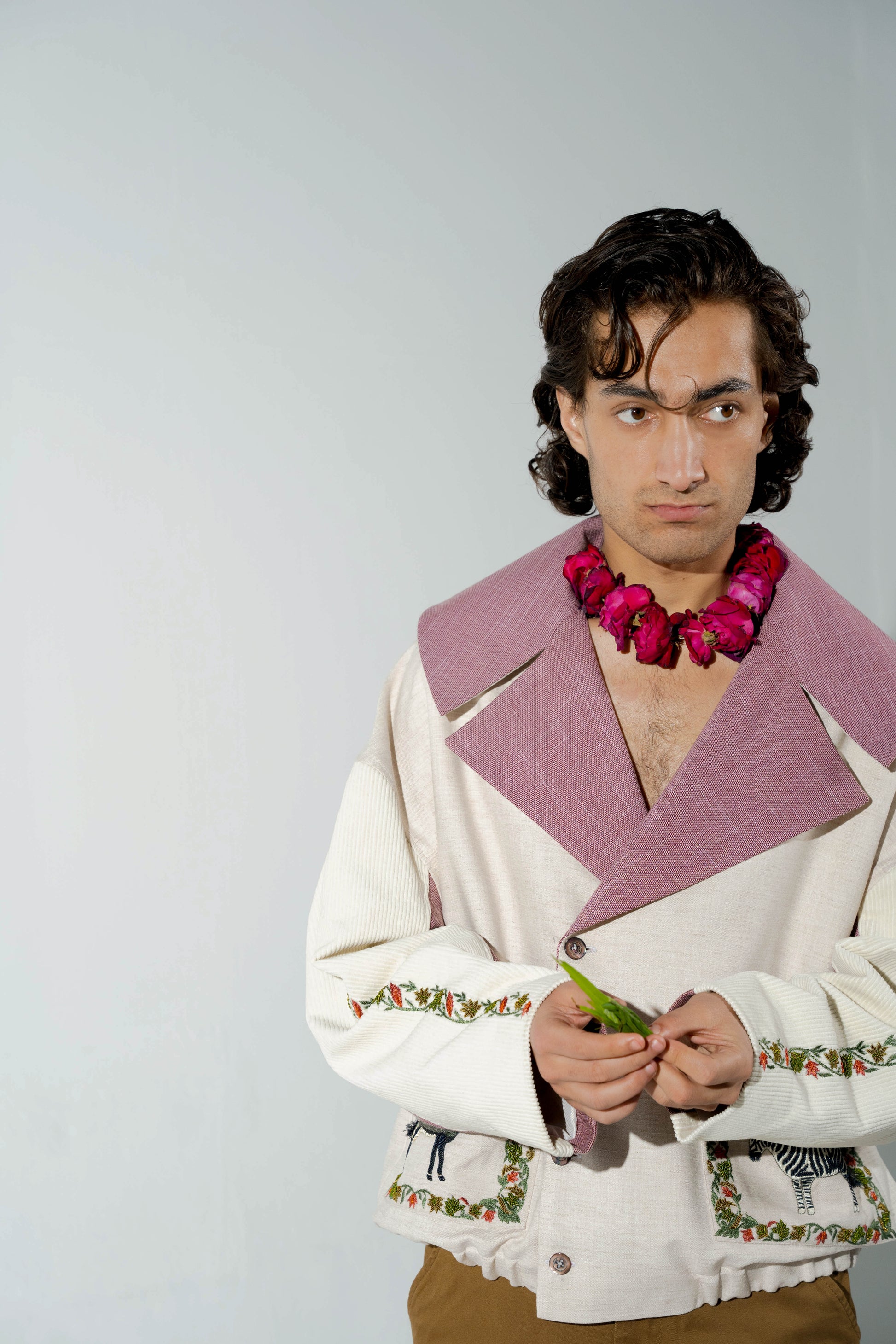 This unisex jacket features an oversized double lapel crop silhouette and mulberry silk liniing. 